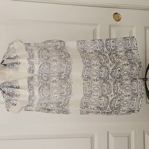 Cabi | Scrollwork sleeveless tunic top in ivory and navy polyester chiffon. 